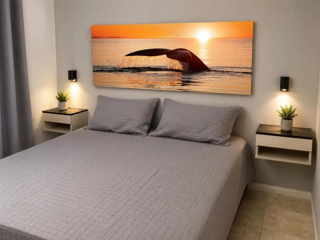 Dormitorio con cama doble del Departamento Pioneros, alquiler temporario en Puerto Madryn